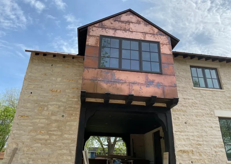 Copper metal panel facade on a stone building for Metal Roof Coating in Bartow